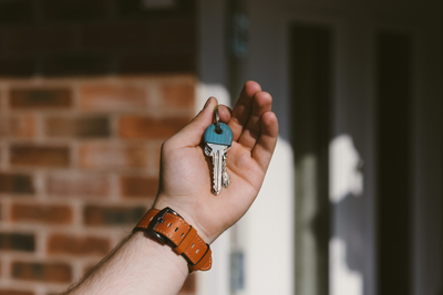 person holding a pair of keys