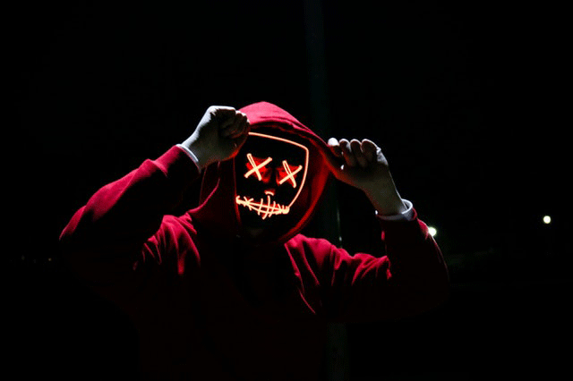 Cyber criminal in red hoodie - Schill Insurance